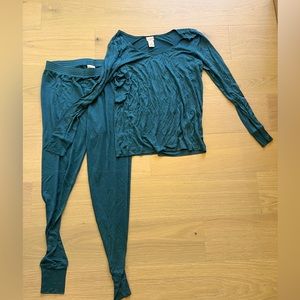 Brand New! Never worn! Top and bottom real silk base layer to keep you warm.